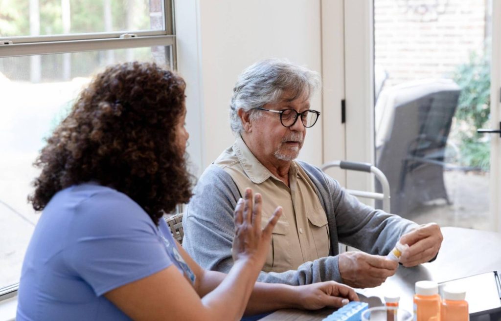 Community nurse providing health care services to a client in their home