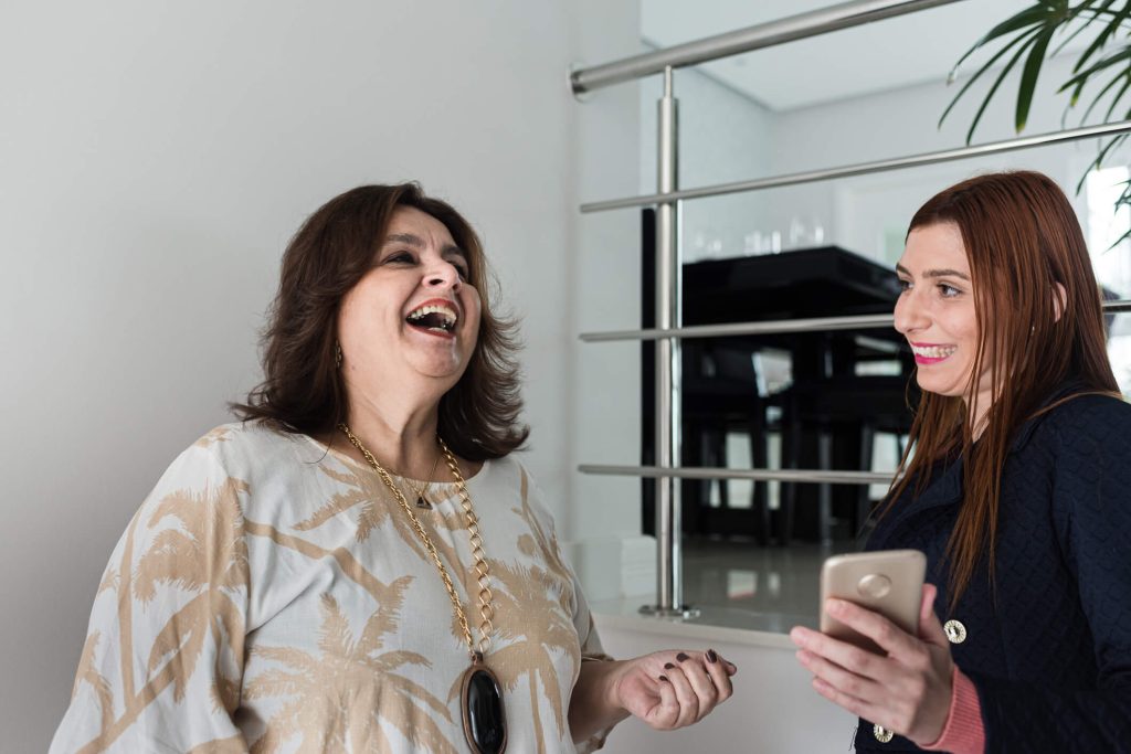 Support worker teaching a participant how to prepare a meal as part of life skills development.