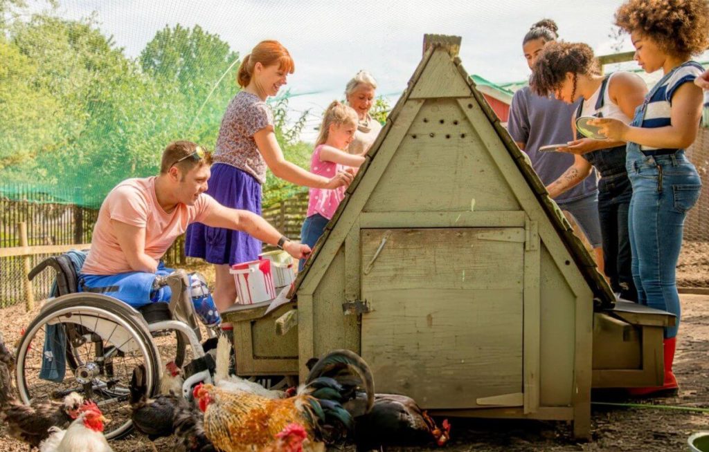 Group of people with disabilities enjoying a community event or recreational activity together.