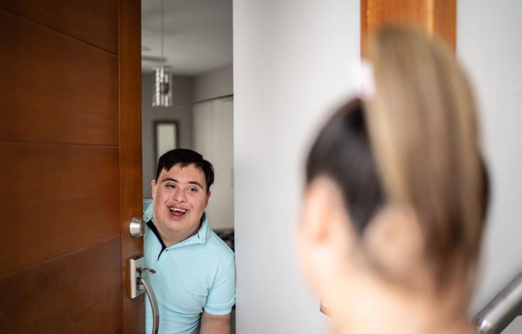 Participant relaxing in a short-term accommodation room designed for respite and support.